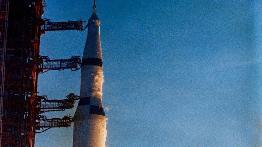A Saturn V rocket blasts off from its launchpad