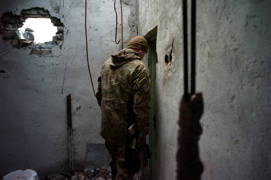 A Ukrainian Marine retreats deeper into a shelled Soviet-era sanatorium, now a dilapidated outpost and his home for 3 months.