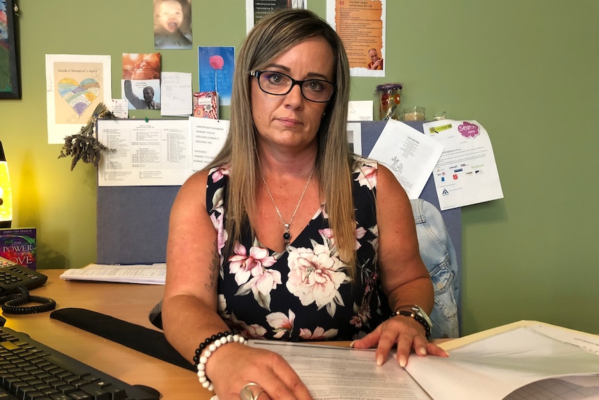 Housing Tasmania case worker Tara sitting at her desk, March 3 2019