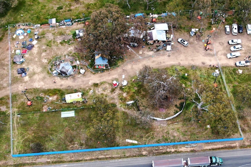 A view from a drone showing a construction site which has been halted over a protest about significant trees.