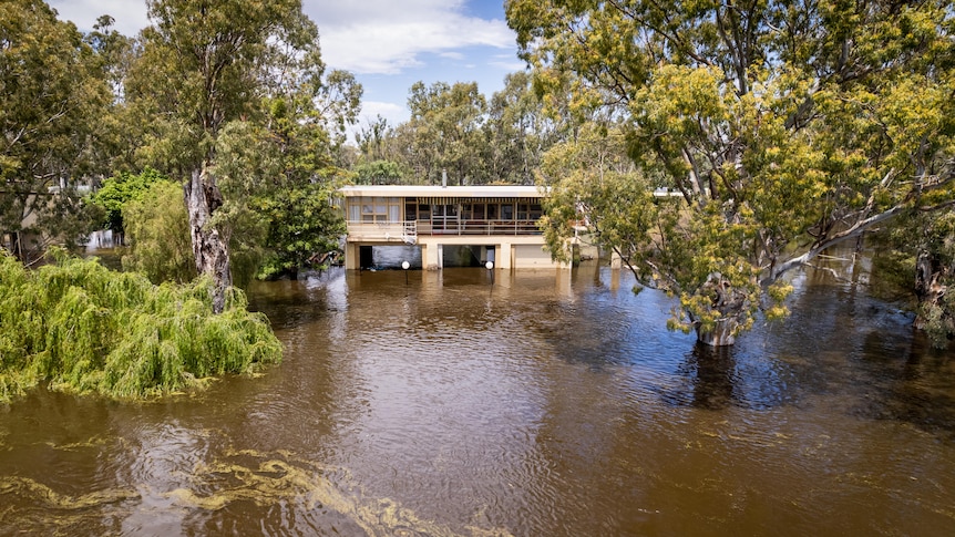 A two-storey home with the bottom level innundated.