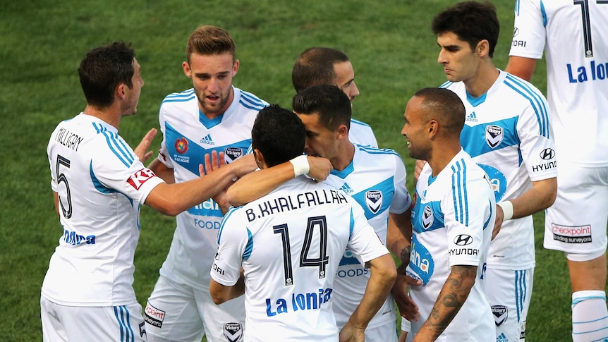 Melbourne Victory players celebrate Fahid Ben Khalfallah's goal against Adelaide United