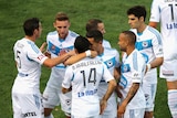 Melbourne Victory's Fahid Ben Khalfallah and team-mates celebrate his goal against Adelaide United.