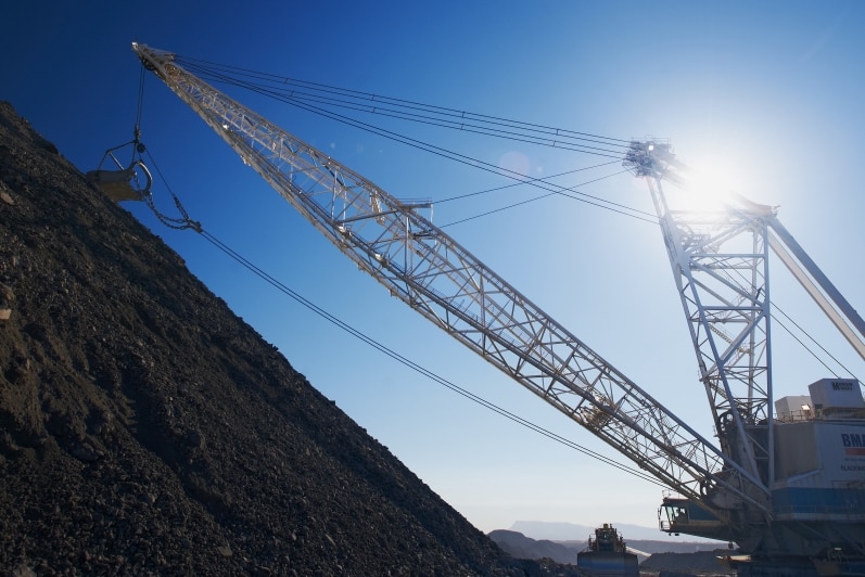 An excavator working on a mine site.