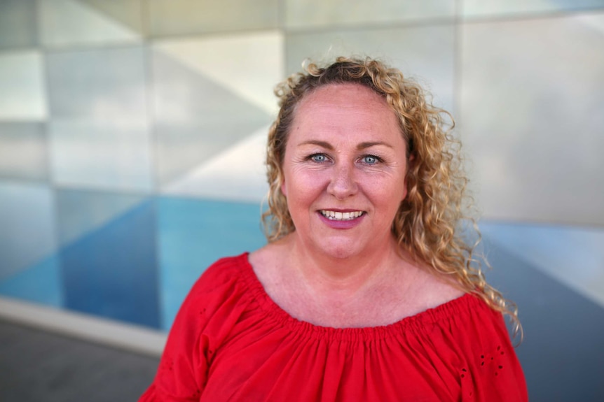 A midshot of recruitment specialist Suzanne Bailey in front of the ABC studios in East Perth.