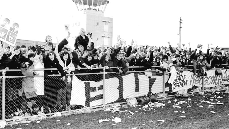 Fans wait for the arrival The Beatles at Essendon Airport, June 1964