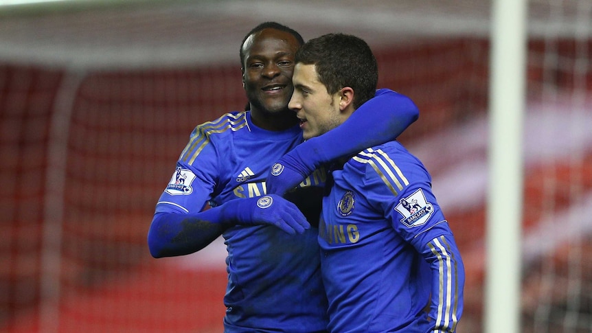 Safely through ... Victor Moses (L) and Eden Hazard celebrate Chelsea's second goal