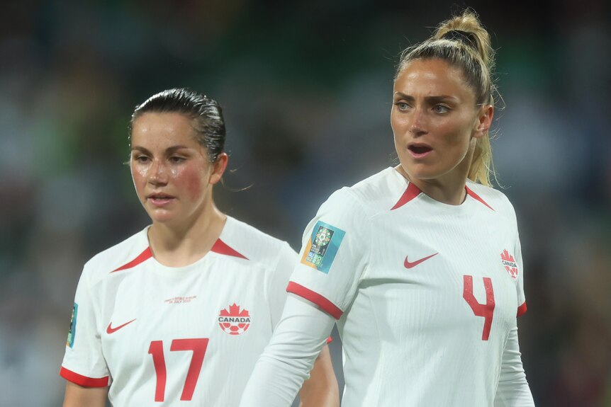 Two Canadian players look on during their Women's World Cup match against Ireland.
