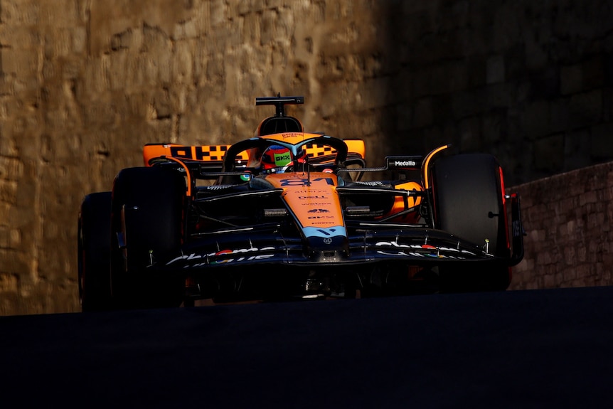 Oscar Piastri driving his McLaren past a castle during qualifying for the Azerbaijan Grand Prix