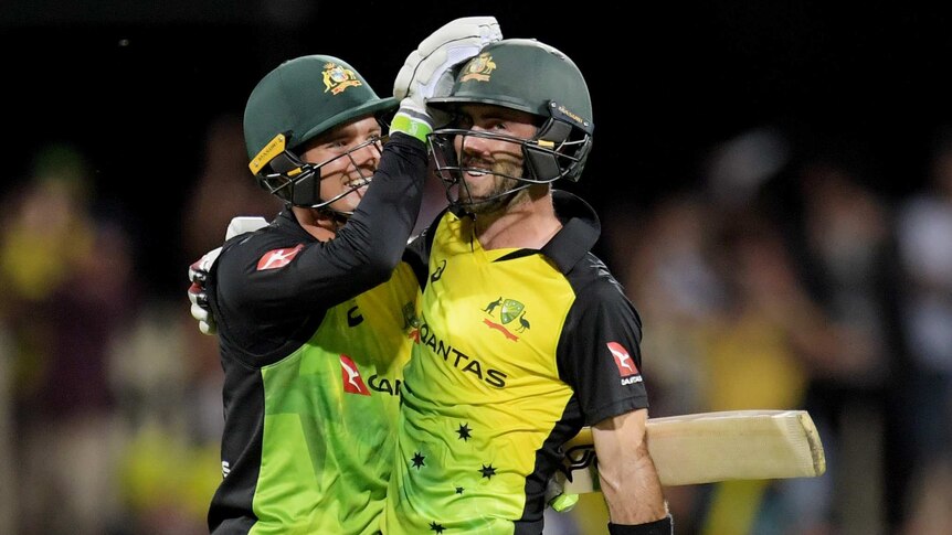 Australia's Glenn Maxwell celebrates with Alex Carey after hitting the winning runs for Australia against England