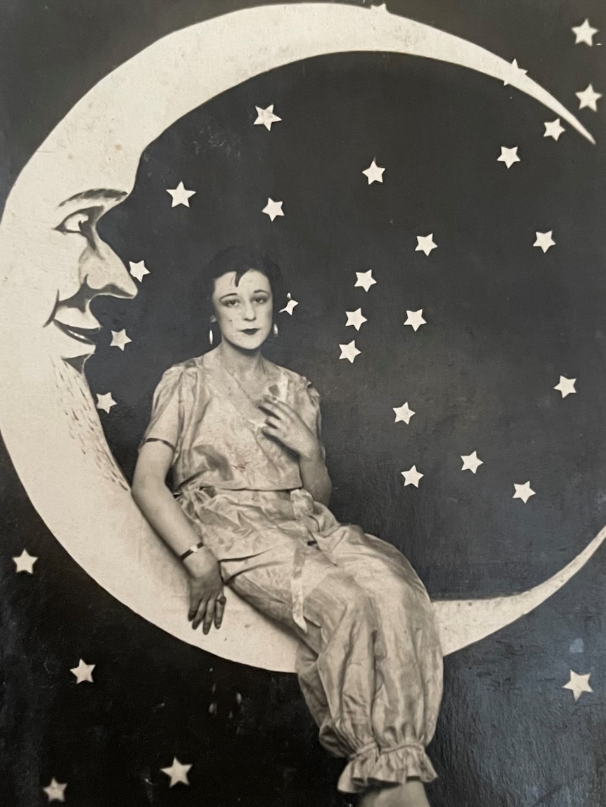 A black and white photo of Myrtle Roberts with a moon and stars backdrop