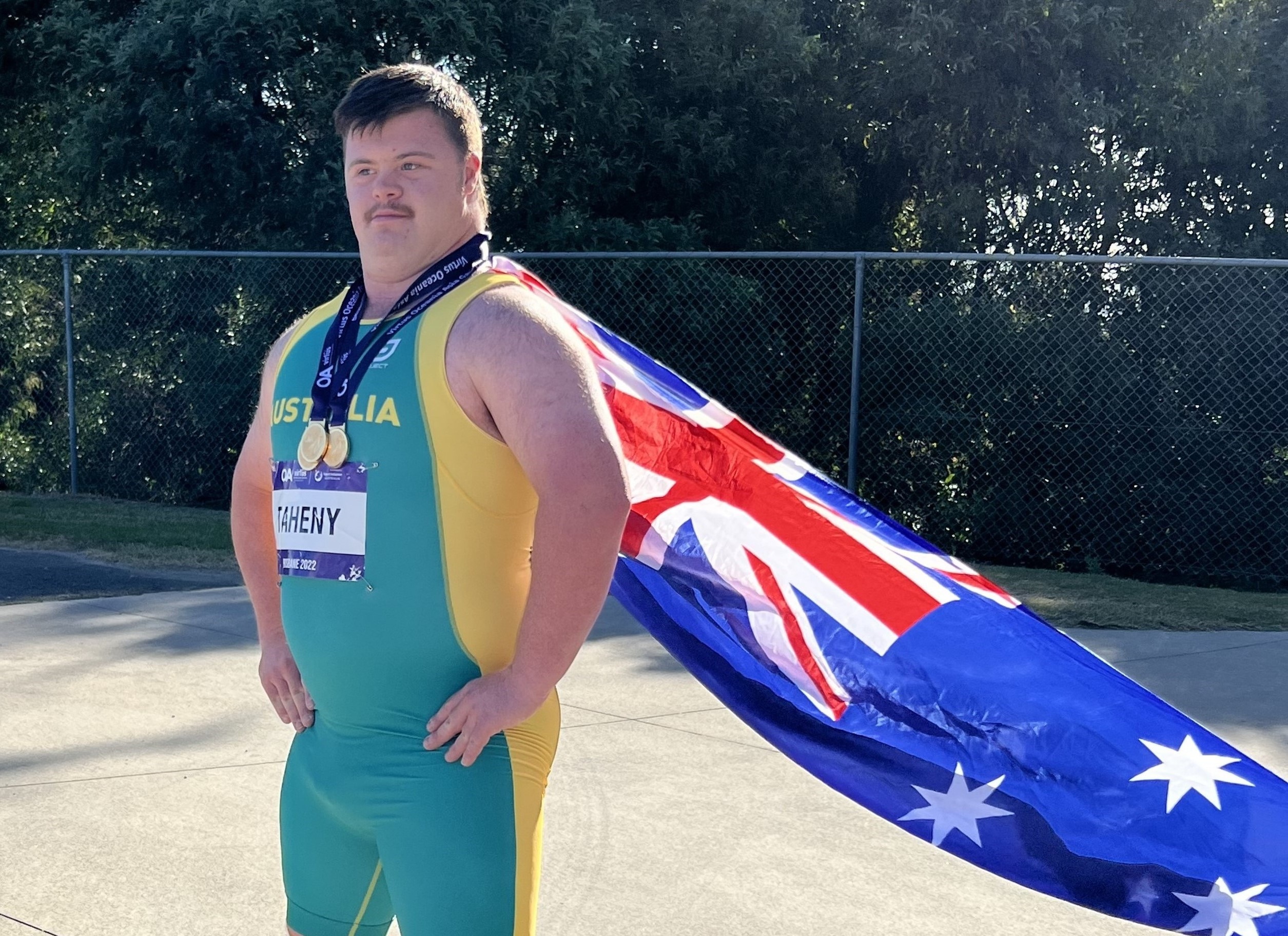 boy wears Australian flag as cape
