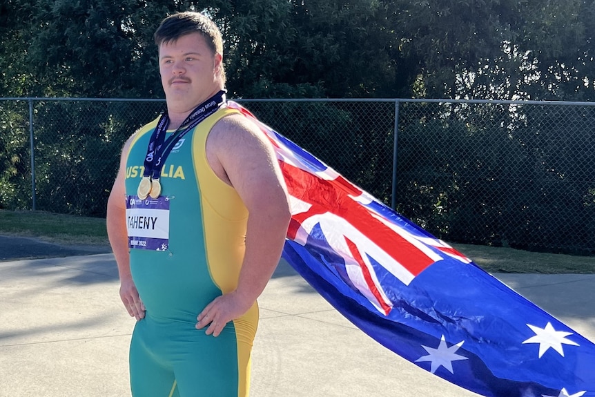 boy wears Australian flag as cape