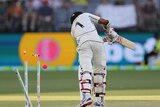 Jeet Raval's stumps go flying as he is bowled in Perth