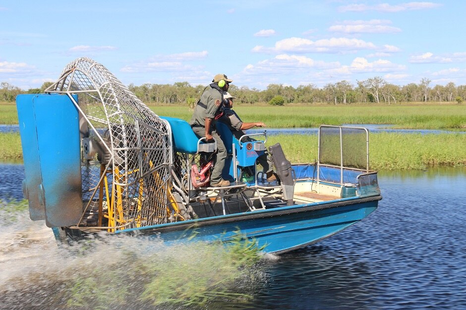 Park rangers Fred Hunter and Calvin Murakami cruise the Magela floodplain in an airboat