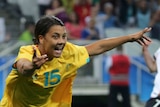 Samantha Kerr is seen celebrating a goal.