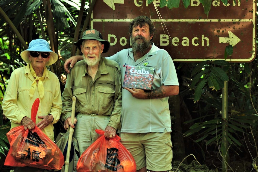 An elderly couple with Christmas Island taxi driver Chris Carr