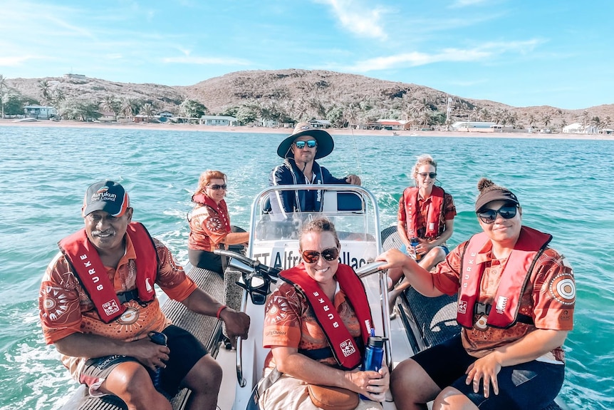 Six people on a boat.