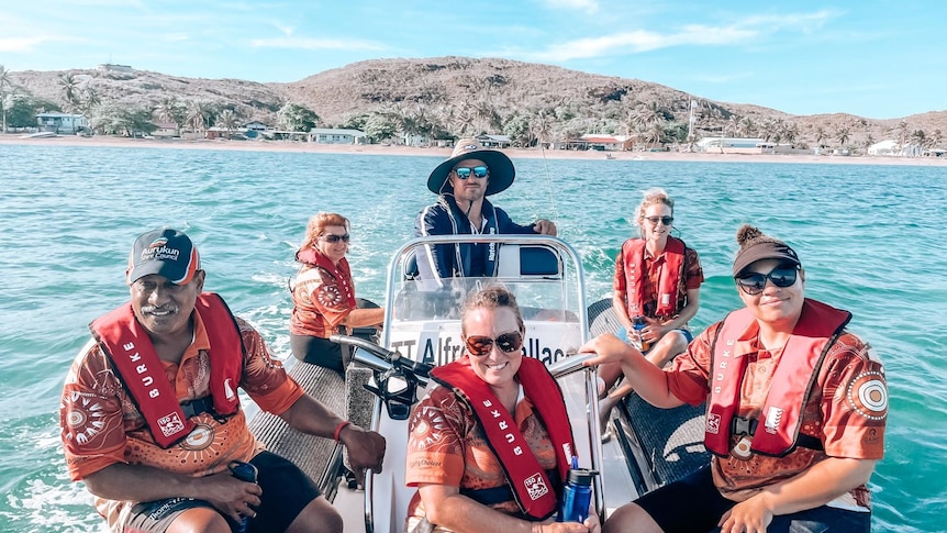 Six people on a boat.