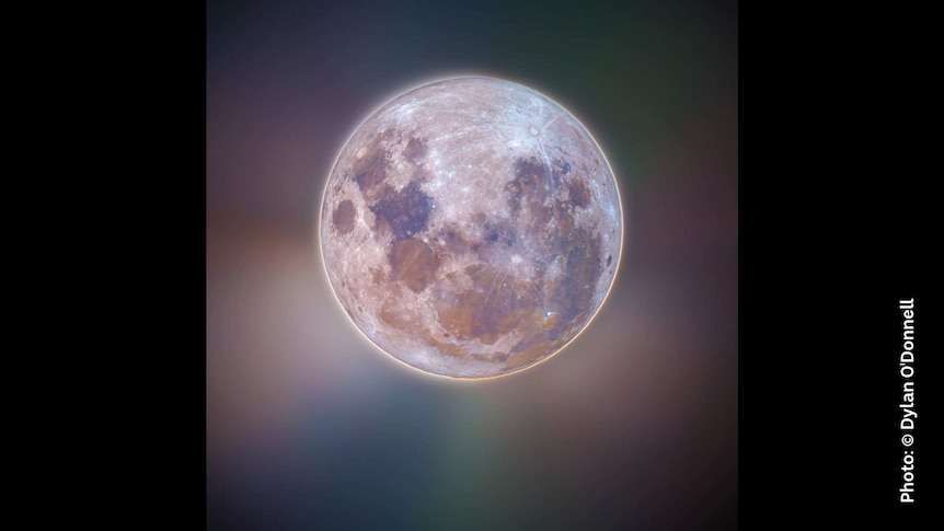 Stylised image of the Moon with a multi-chromatic glow