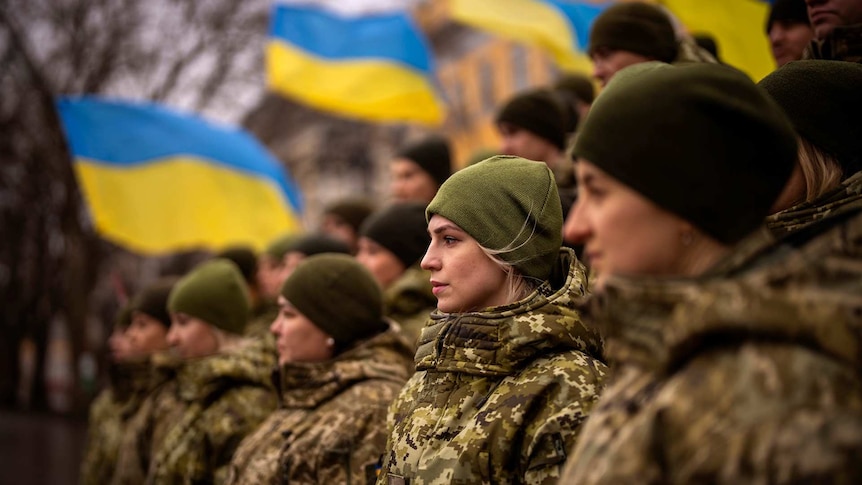 Ukrainian Army soldiers pose for a photo as they gather to celebrate a Day of Unity in Odessa, Ukraine