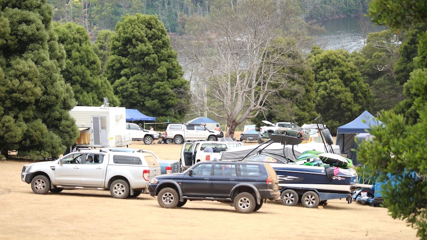 Cars and tents at a campground.