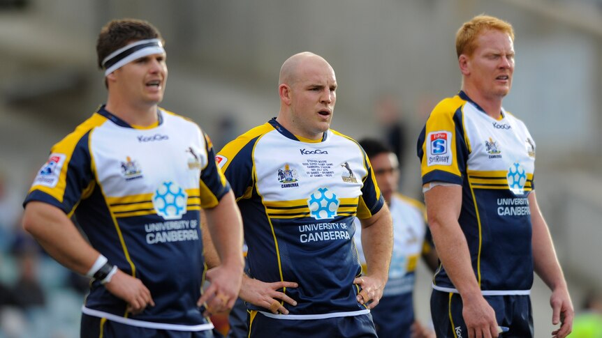 Tough day out ... Brumbies hooker Stephen Moore's (c) 100th Super Rugby appearance was spoiled.