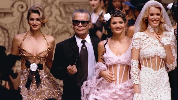 Fashion designer Karl Lagerfeld walks the catwalk with leading models Cindy Crawford, Helena Christensen and Claudia Schiffer.