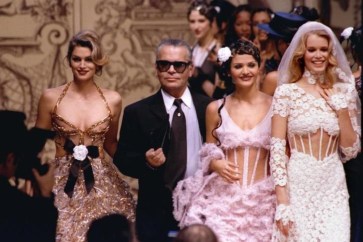 Fashion designer Karl Lagerfeld walks the catwalk with leading models Cindy Crawford, Helena Christensen and Claudia Schiffer.