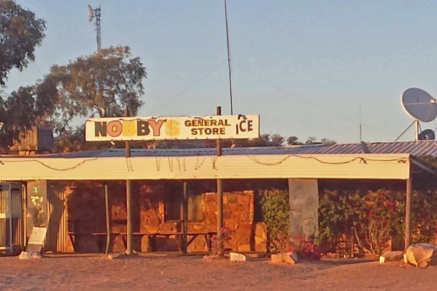 The general store at Mintabie in a dusty landscape.