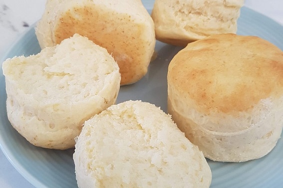 A plate of four fluffy scones baked by Jasmine Teese
