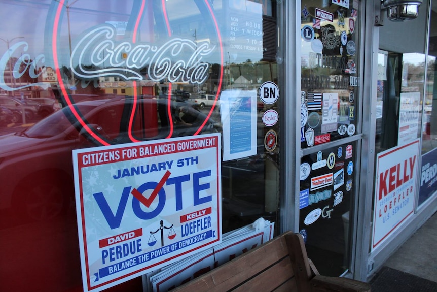 A shopfront showing election signs