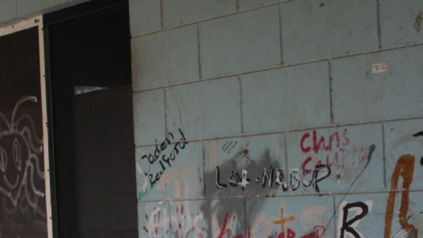 The wall outside a refurbished SIHIP house in Maningrida, covered in graffiti.