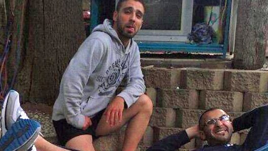 Omar Al-Kutobi and Mohammad Kiad pose for a Facebook photo.