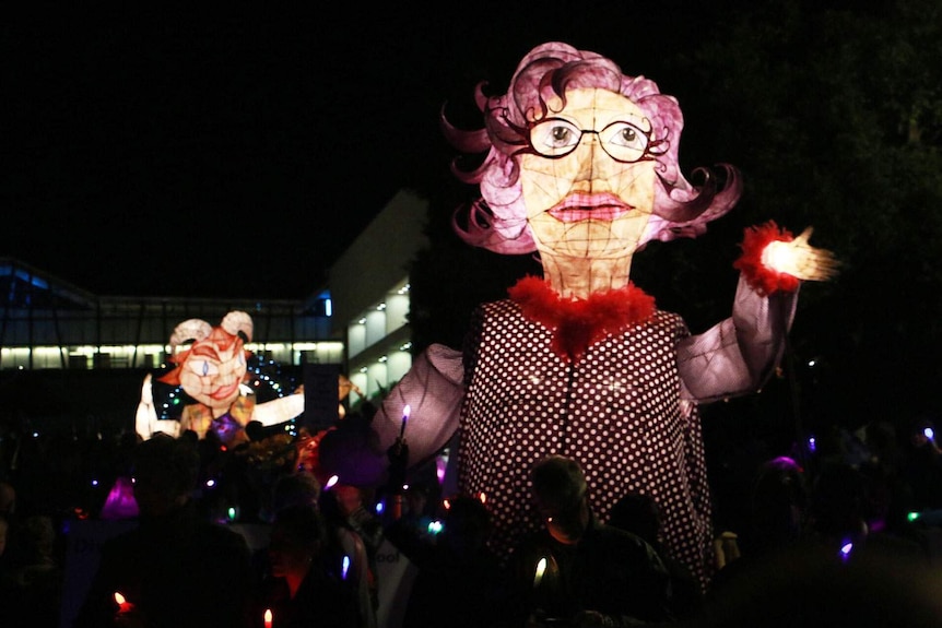 Dame Edna Everage lantern weaves its way in Luminous Lantern Parade at South Bank in Brisbane on June 5, 2015.