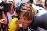 Andy Schleck consoled after time trial