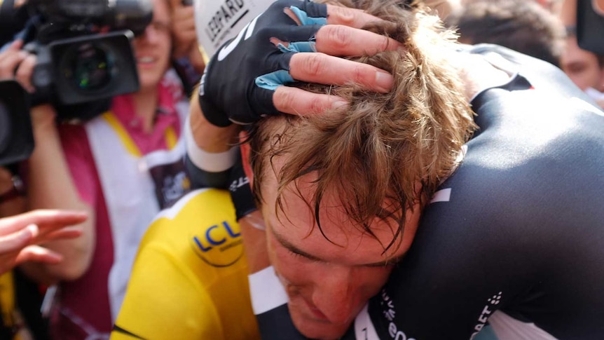 Andy Schleck consoled after time trial