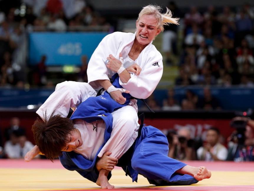Hungary's Eva Csernoviczki (white) defeats Japan's Tomoko Fukumi.