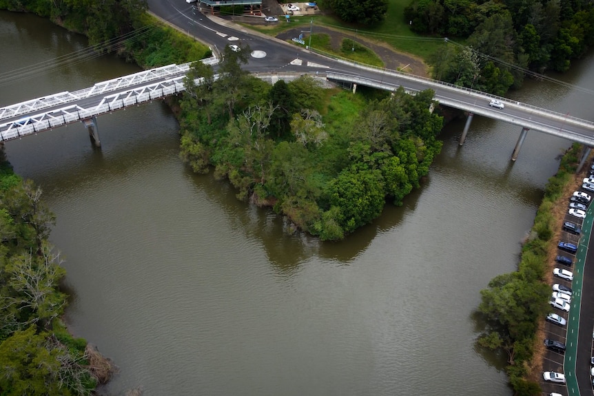 An aerial image of two rivers converging. Bridges over  both.