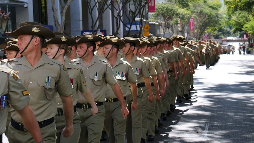 Soldiers marching in formation along Adelaide Street