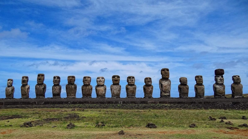 The large, stylised stone head statues of the fifteen moai that form the Ahu Tongariki on Easter Island.