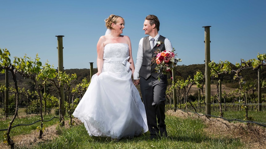 Amanda and Amy look at each other on their wedding day.