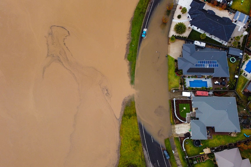 Traralgon Creek floods residential streets, drone photo