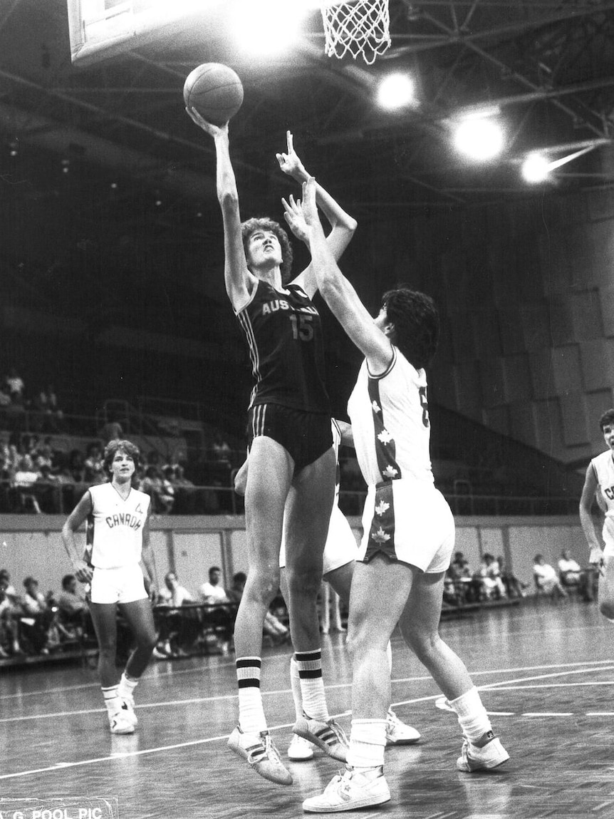 Sue Geh playing basketball against Canada.