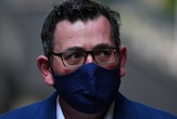 Victorian Premier Daniel Andrews wearing a face mask, arriving for a media conference.