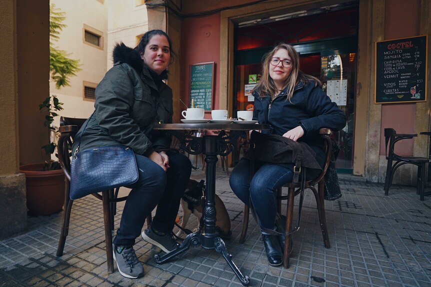 Carol Ruiz and her best friend Gemma Pera have coffee at a cafe in Barcelona.