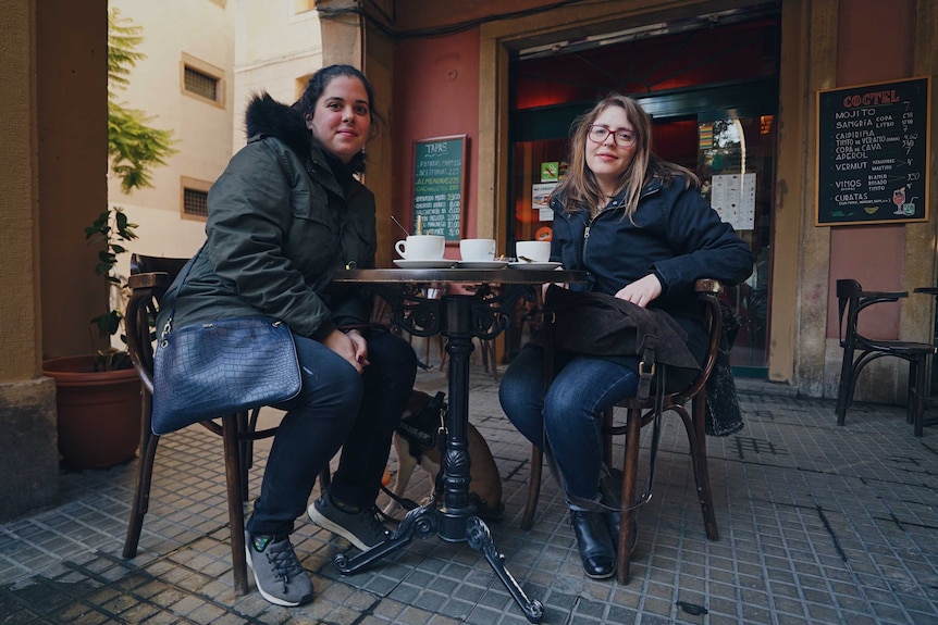 Carol Ruiz and her best friend Gemma Pera have coffee at a cafe in Barcelona.