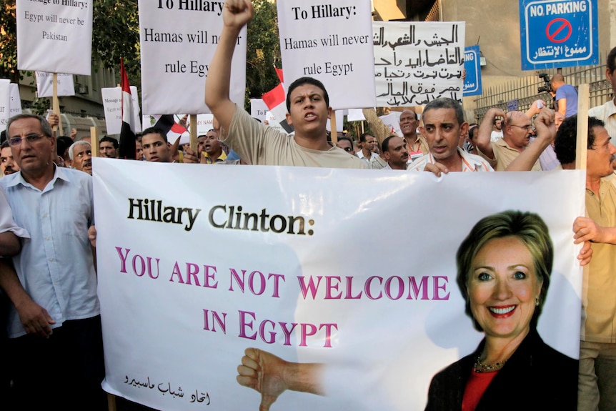 Protesters chant slogans against the visit of Hillary Clinton near the US Embassy in Cairo, Egypt.