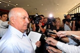 founder of Storm Financial, Emmanuel Cassimatis fields questions from media in Brisbane in 2009.