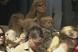 Terri and the Irwin children at the memorial at Australia Zoo.